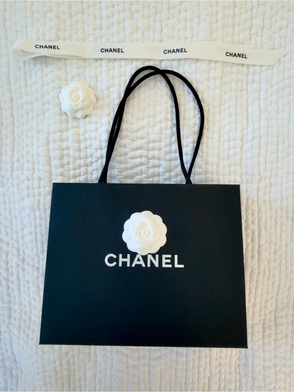 CHANEL Black Shopping Bag with White Camellia Accent